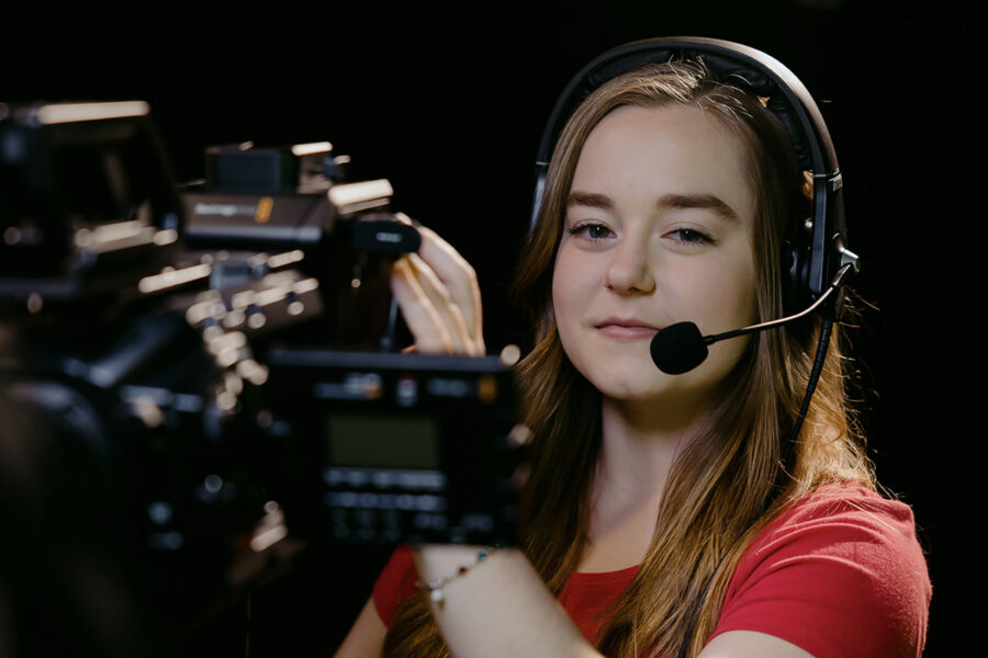 a cinema arts student holding a video camera