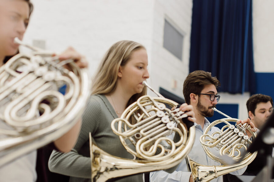 students from the music education program playing the french horn