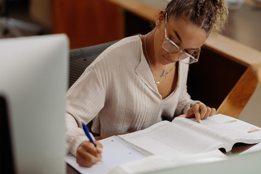 a journalism student studies for an exam