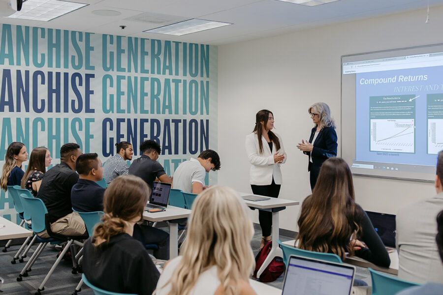 students participating in a classroom lecture with a power point presentation