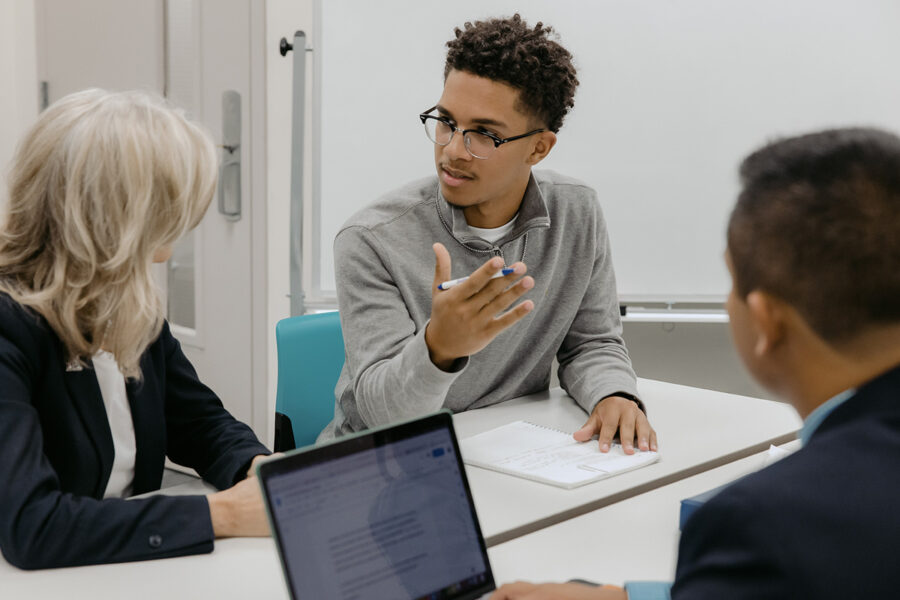 Students from the business data analytics program engage in a classroom discussion.