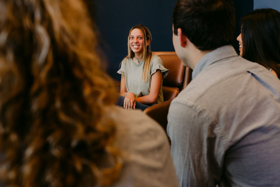 an intercultural studies major discusses with classmates