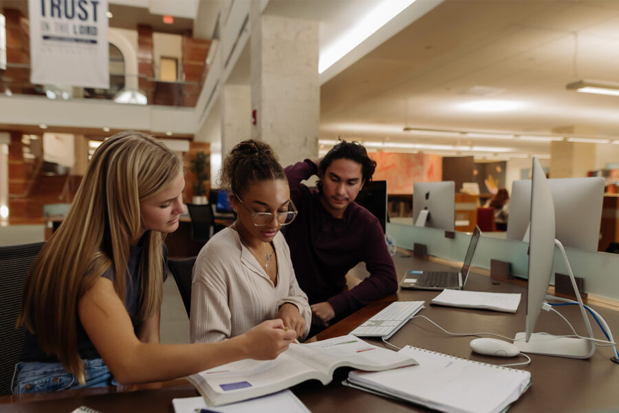 Philosophy and global development students study in the library