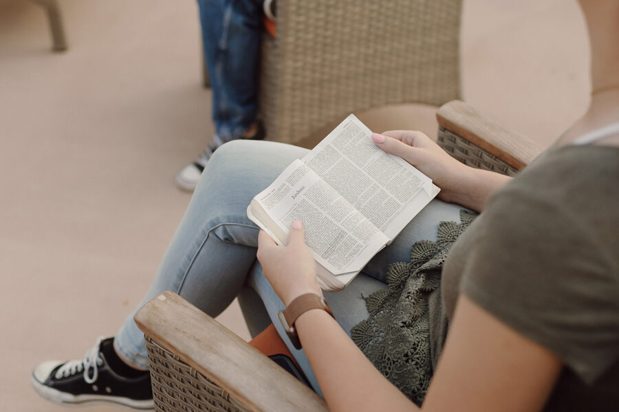 A biblical studies major reading a Bible