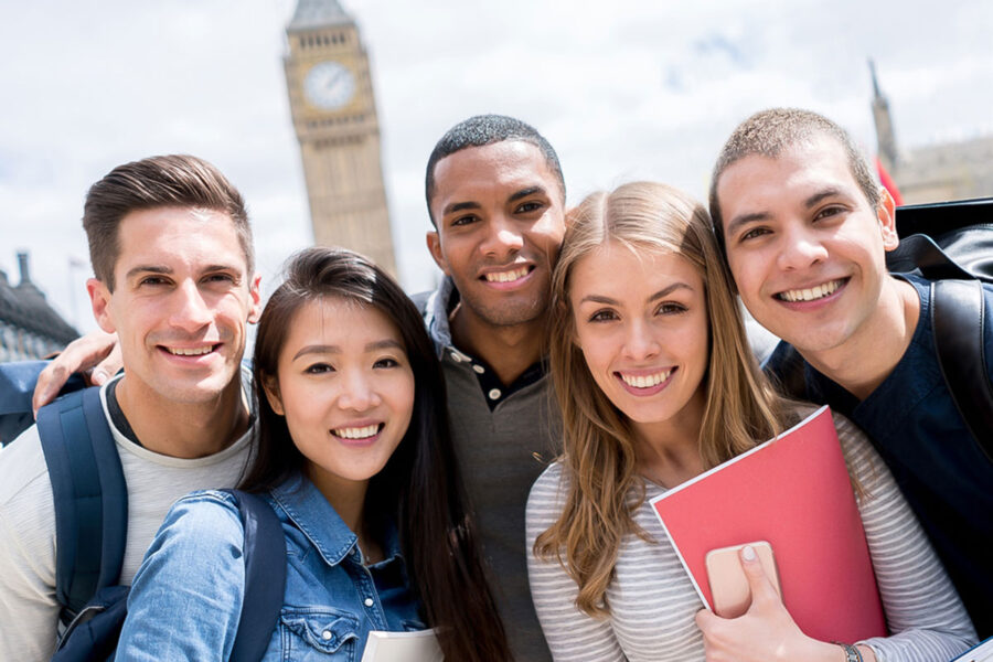 study abroad students standing in a group smiling