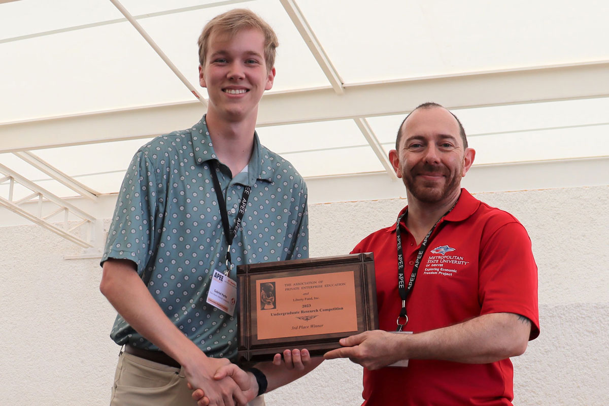 Gabriel Parke receiving award at undergraduate research conference