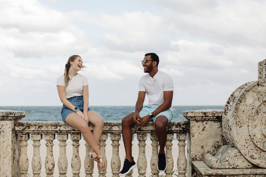 Two PBA students talk by the beach.