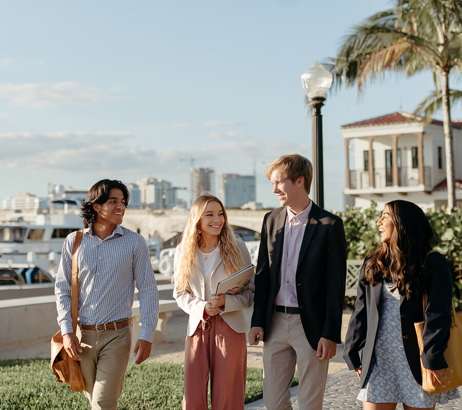 master of business administration mba students walk near the intercoastal waterway in West Palm Beach.