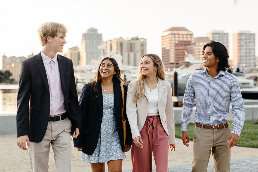 Students from the business administration BSBA program walk along the intercoastal in West Palm Beach.