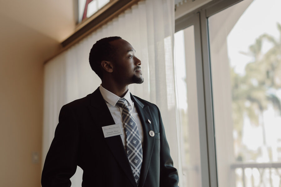 Business student looks out of window at Palm Beach Atlantic University