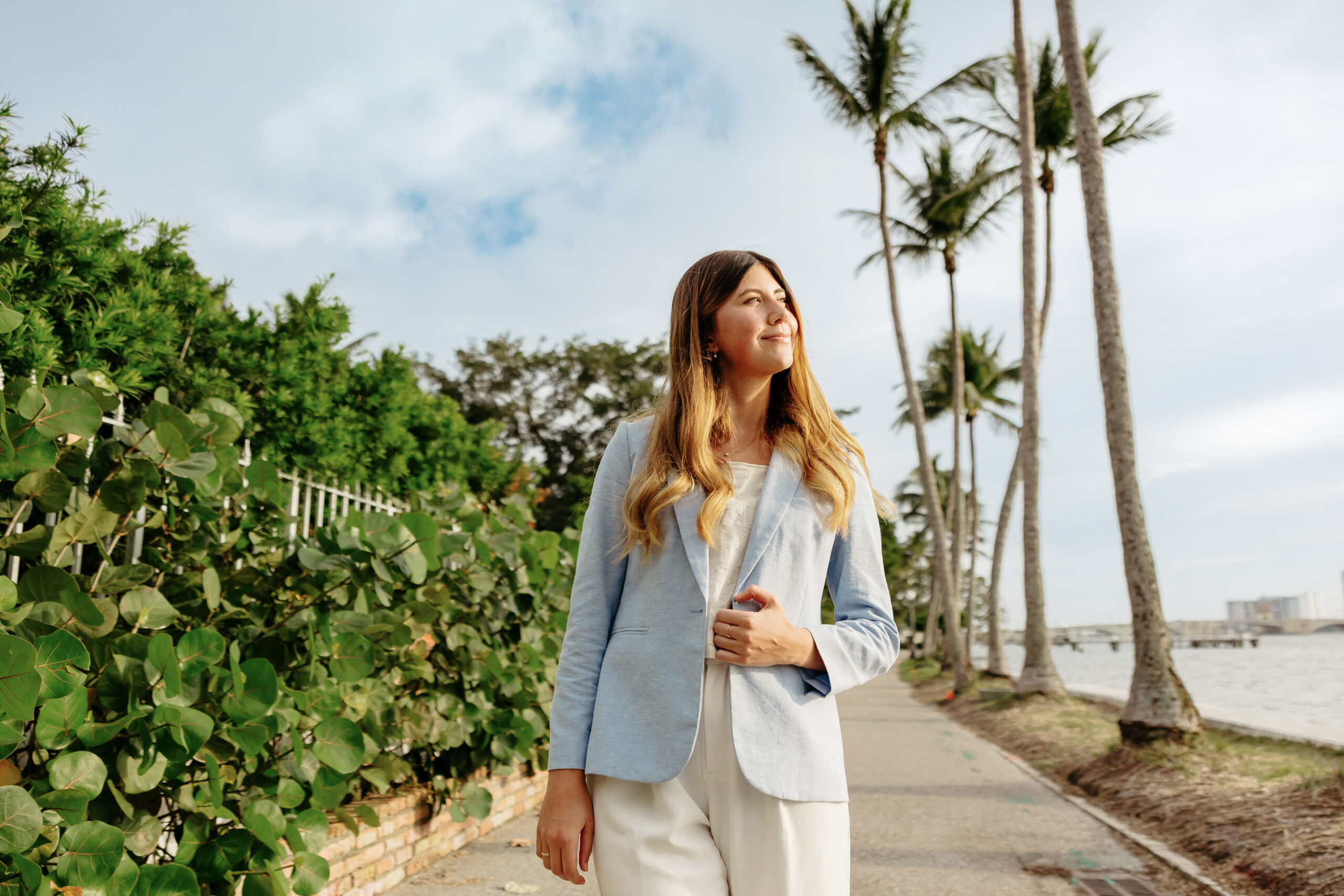 A Palm Beach Atlantic student enjoys the sun and Florida flora.