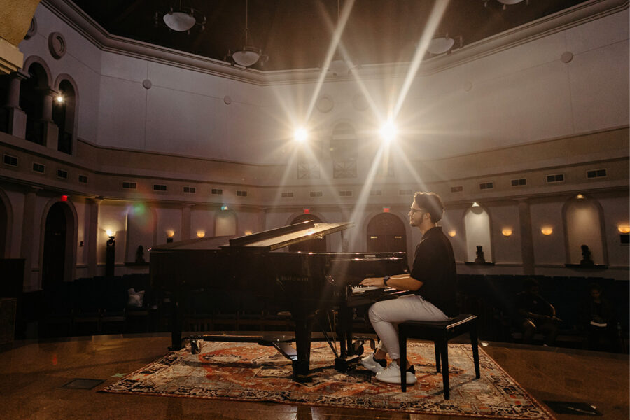 A man plays the piano at Palm Beach Atlantic's annual Hispanic music festival.