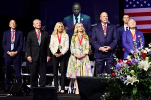 American Free Enterprise medalists on a patriotic stage.
