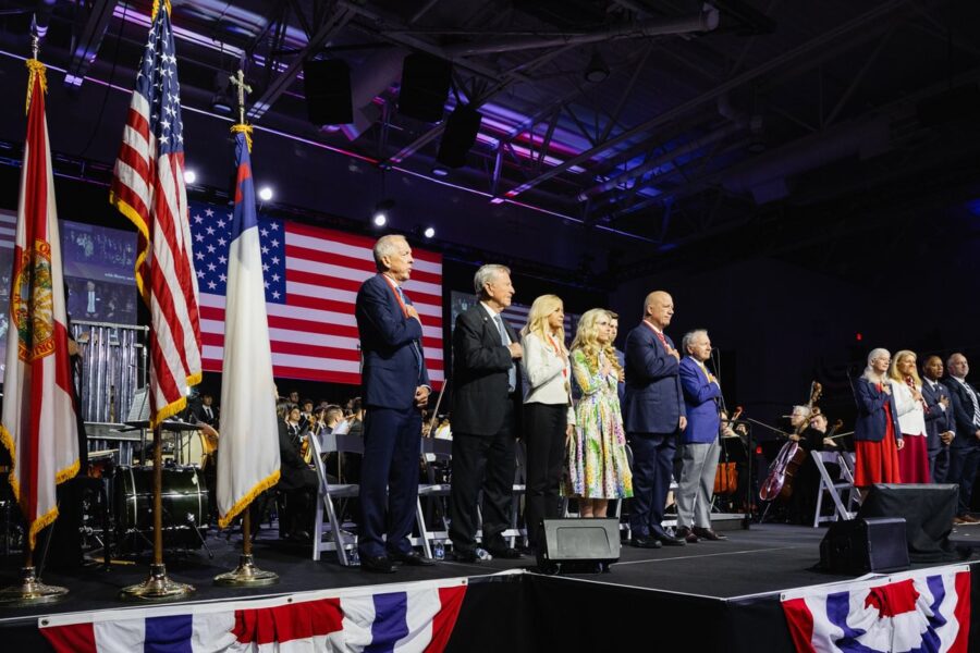 American Free Enterprise medalists pledge allegiance to the nation's flag at Palm Beach Atlantic University's 41st annual event.