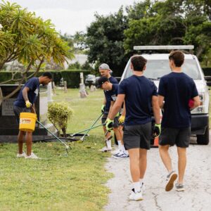 Palm Beach Atlantic University's men's soccer team picks up litter at local cemetery.