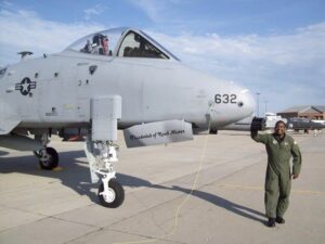 Roderick Farmer poses with an aircraft from the United States Air Force.