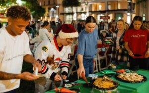 Students decorate Christmas cookies.