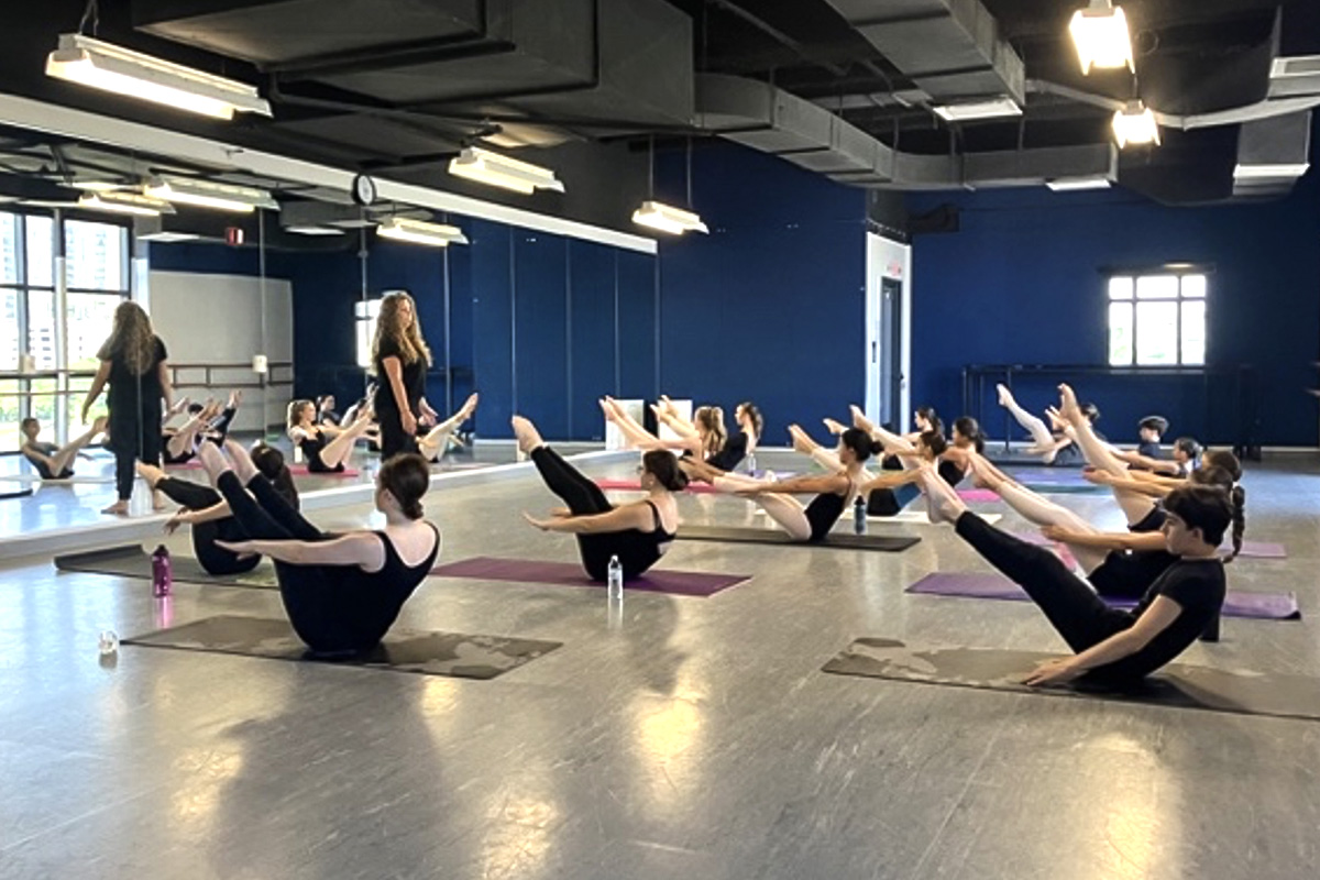 Dance students stretching during a class