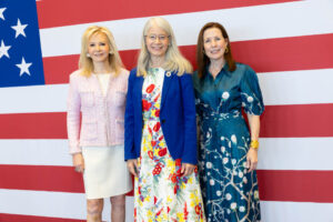 2026 Women of Distinction honorees Hilary Geary Ross (left) and Sarah McCann (right) with PBA President Dr. Debra A. Schwinn (center).