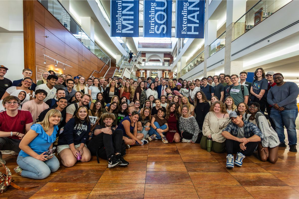 Actor John Rhys-Davies with Palm Beach Atlantic University students in the Warren Library.