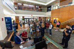 John Rhys-Davies takes photos with Palm Beach Atlantic University students in the Warren Library.