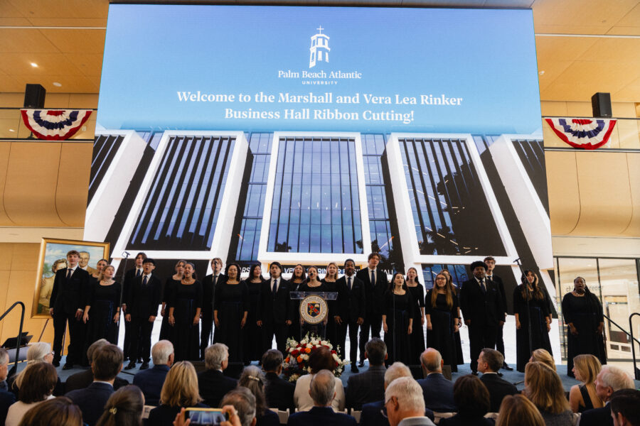 Palm Beach Atlantic University student choir sings at grand opening of new Marshall and Vera Lea Rinker Business Hall.