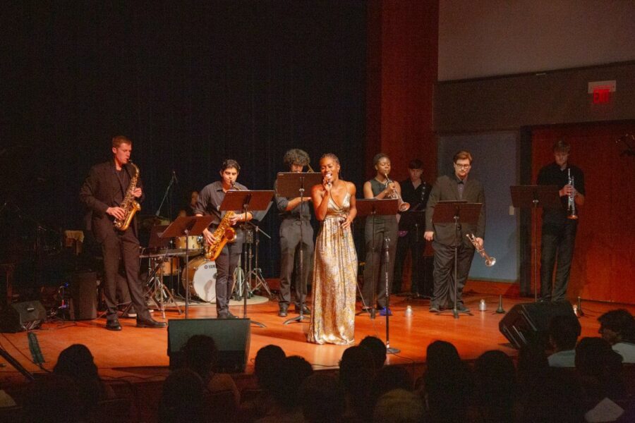 Jazz ensemble plays on stage with a singer
