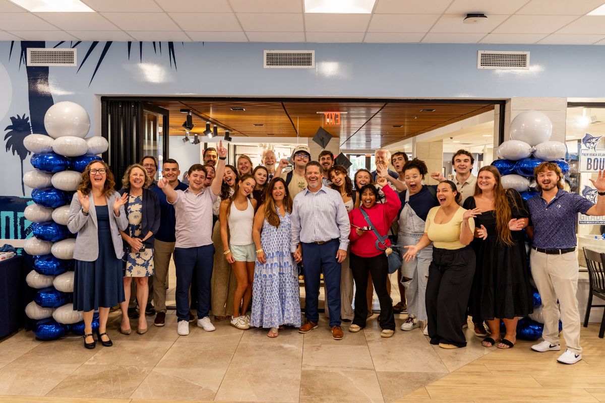 Students, faculty, and friends cheer for Palm Beach Atlantic University campus pastor Dr. Bernie Cueto.