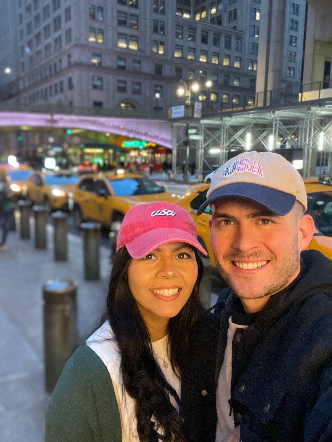 Joshua and Melissa Michael pose together on busy street