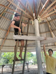 Palm Beach Atlantic University School of Education and Behavioral Studies Outstanding Graduate Thomas Myers climbs a wooden ladder to make repairs on a mission trip in Brazil.