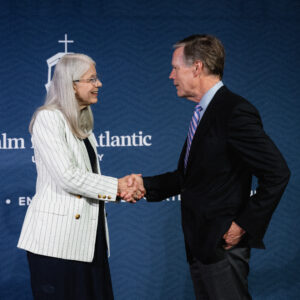 Ambassador Nicholas Burns (right) greets President Debra Schwinn (left) at Palm Beach Atlantic University during the LeMieux Speaker Series on Iran, China, and international diplomacy.