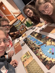 Palm Beach Atlantic University Engineering Department Chair Dr. Fred Browning plays a board game with his family.