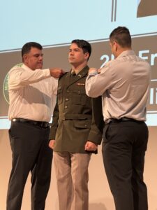 Palm Beach Atlantic University and ROTC program graduate Frederico Ayres Melo Jr. has his military uniform decorated.