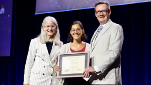 Corts Award Winner on Stage with Dr. Schwinn and Dr. Johnson. 